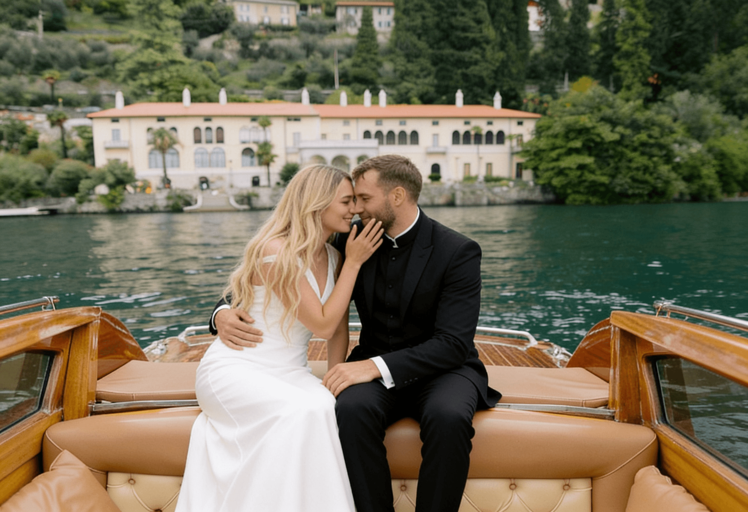 Couple on a classic wooden boat, Lake Como