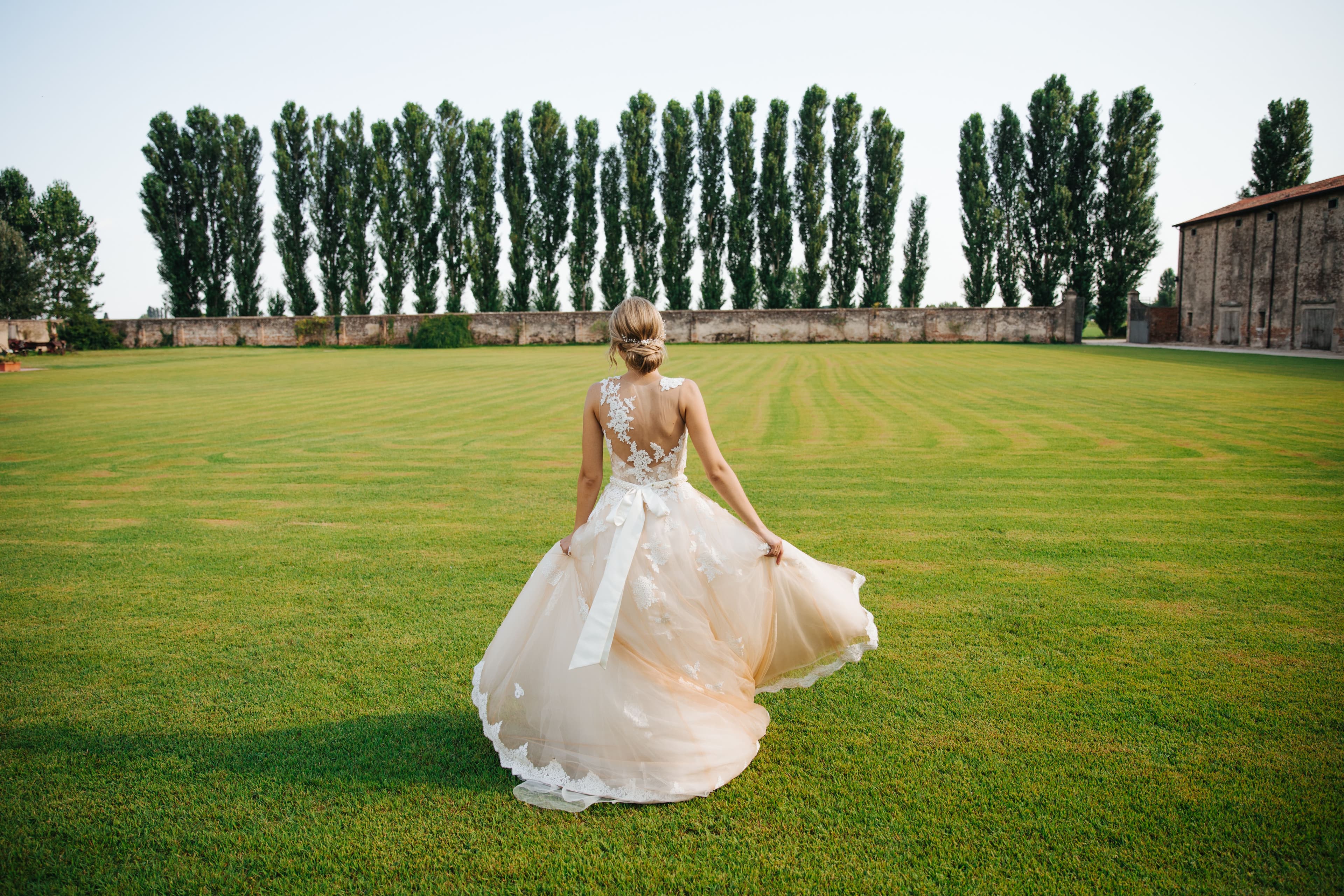 Bride in a green estate field